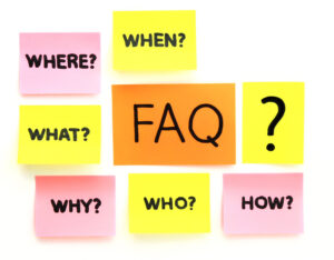 A sticky note with FAQ is surrounded by sticky notes with where when what why who and how.
